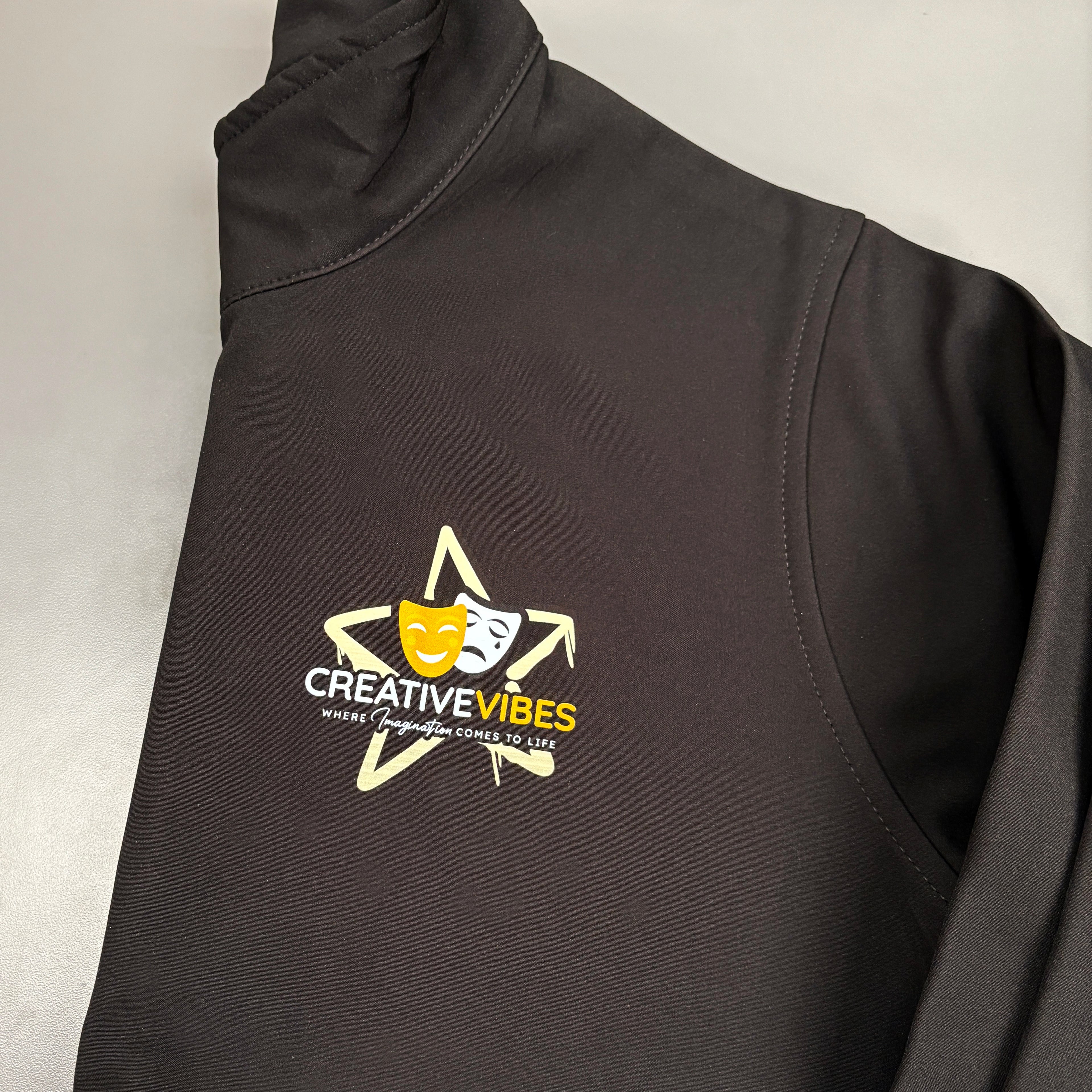 Black jacket business uniform with 'Creative Vibes' logo on a light grey background