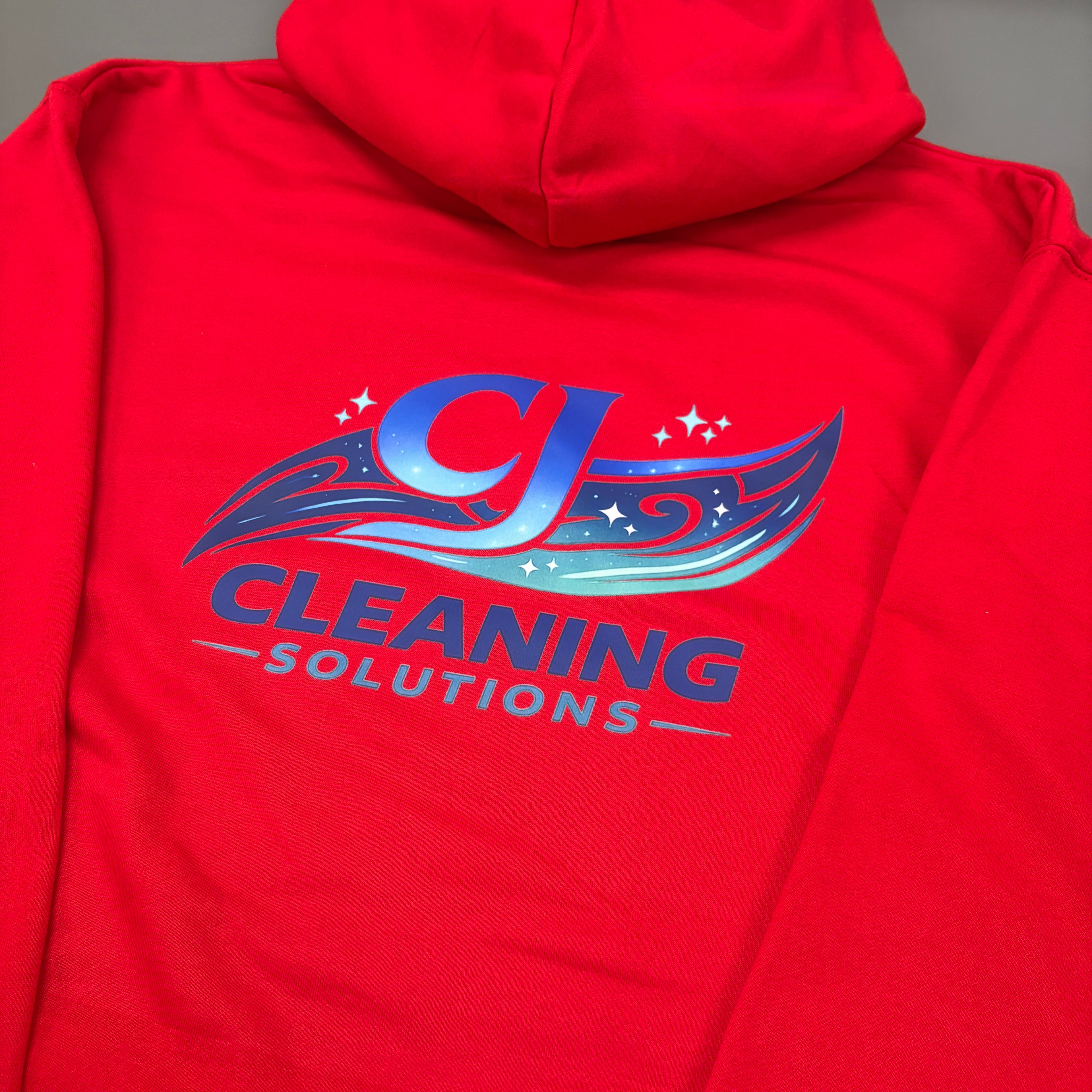 Red custom hoodies with 'CJ Cleaning Solutions' logo on the back